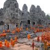 Cambodian Buddhist monks sit at Bayon te